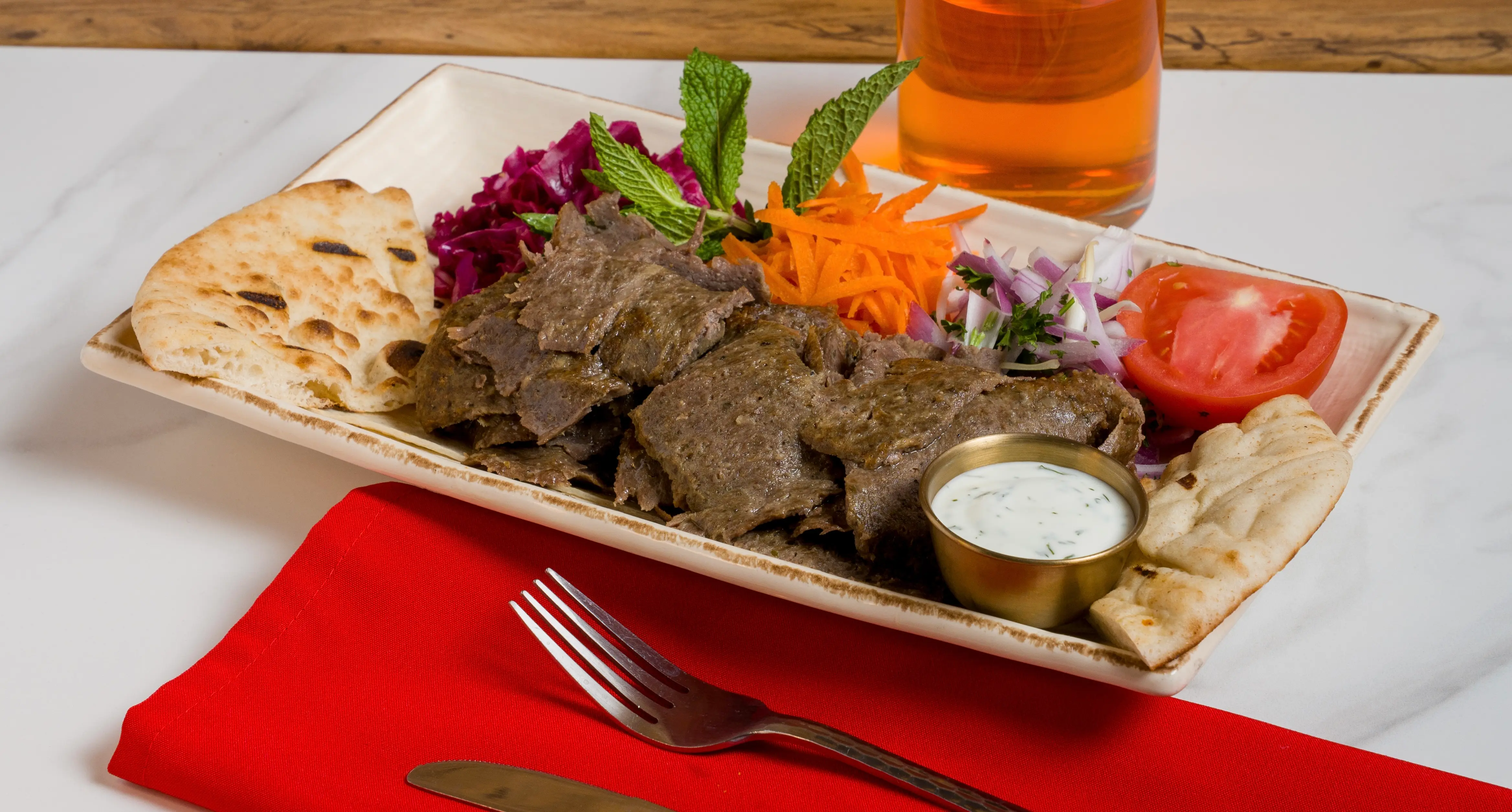 Doner kebab plate with pita and salad