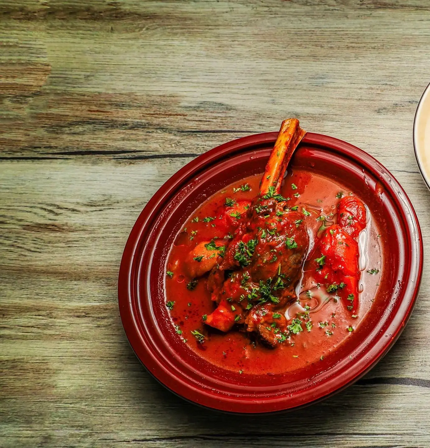 Braised lamb shank in tomato sauce