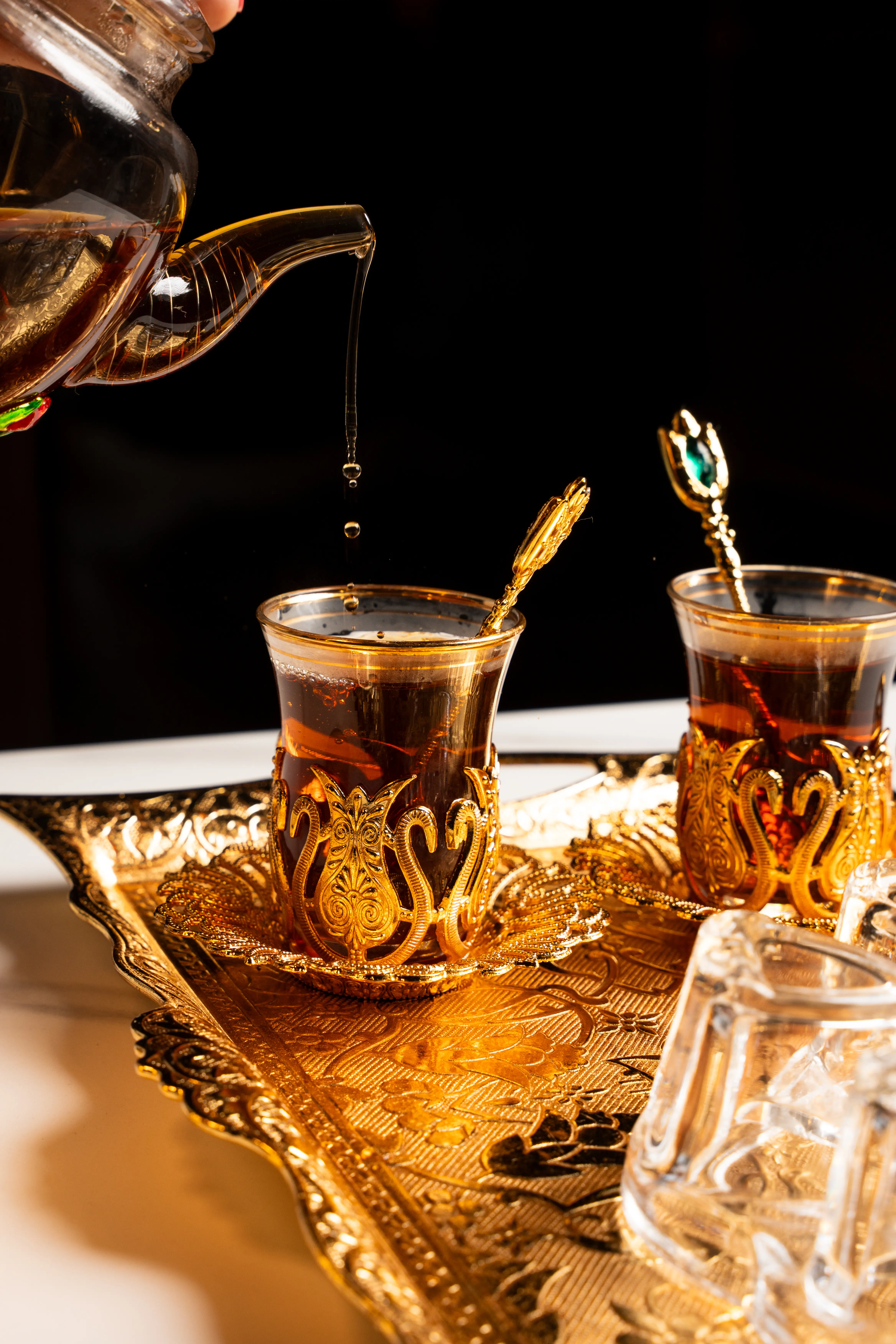 Turkish tea service with ornate gold glasses